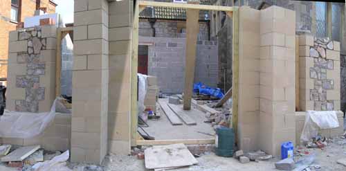 The doorway and windows start to take shape.