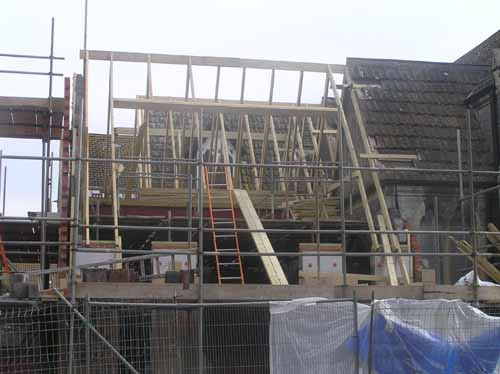 3/6/08 The roof timbers continue to take shape.