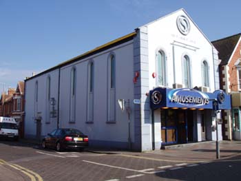 Photograph of the original (1860) Methodist Church, now an amusment arcade and Night Club.